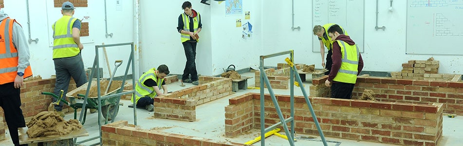 students structuring brick walls
